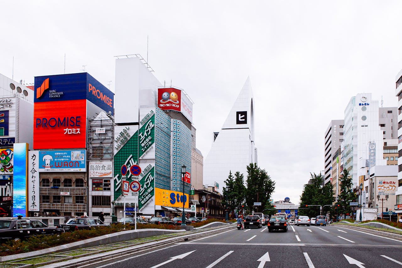 Dynamic cityscape featuring vibrant billboards and traffic in Japan